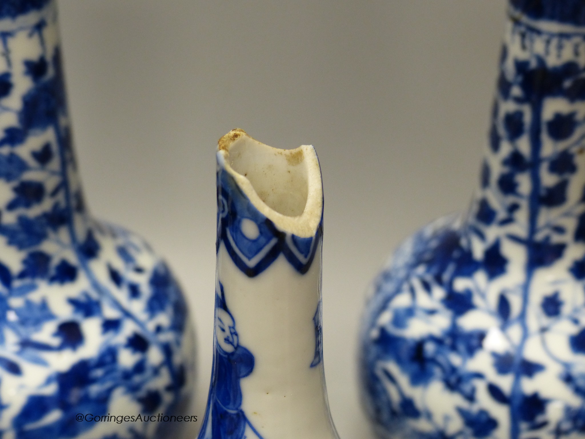 A pair of Chinese blue and white 'dragon' bottle vases, a prunus jar and cover, all late 19th century